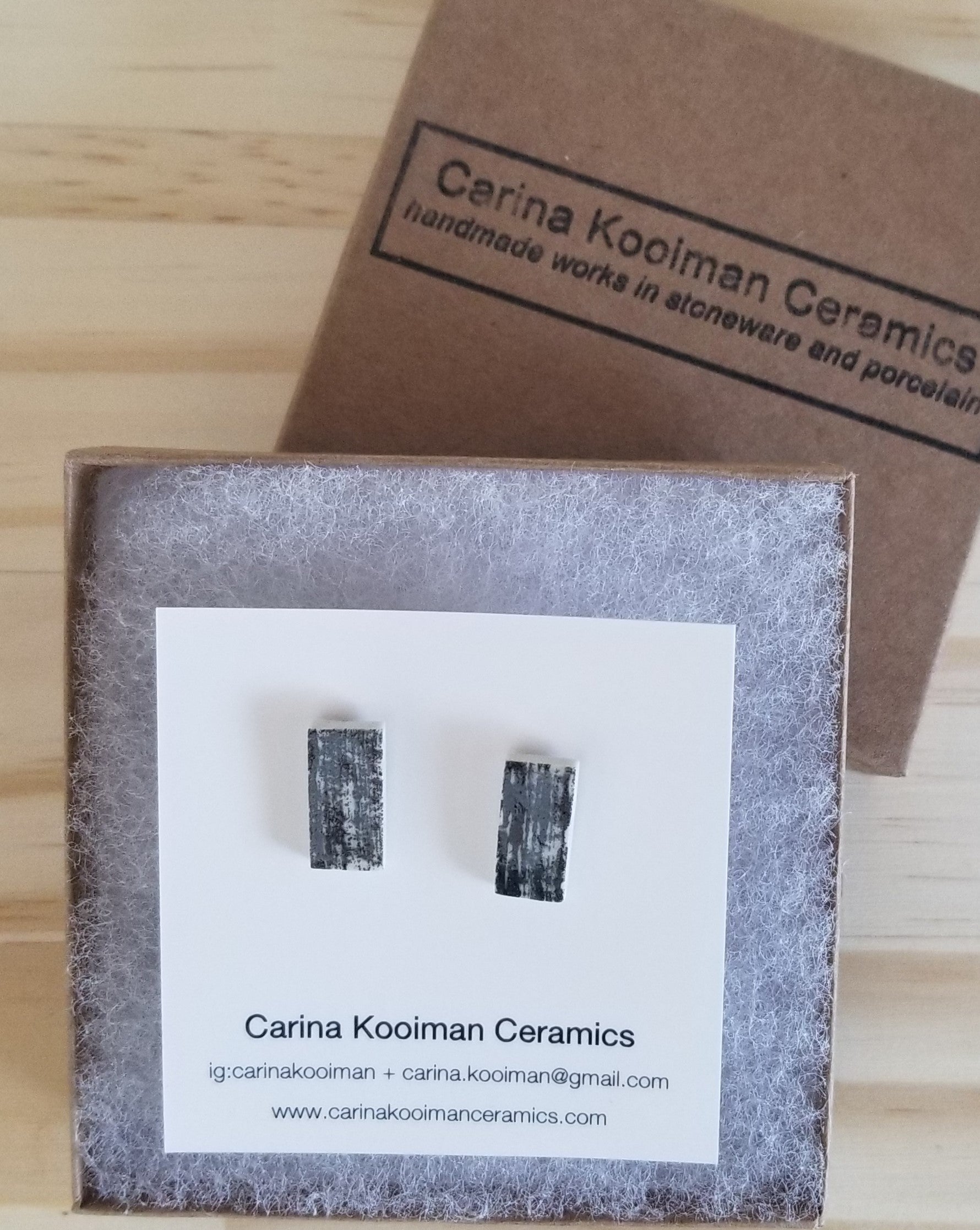 Black printed rectangle studs, in box. Handmade porcelain jewelry.