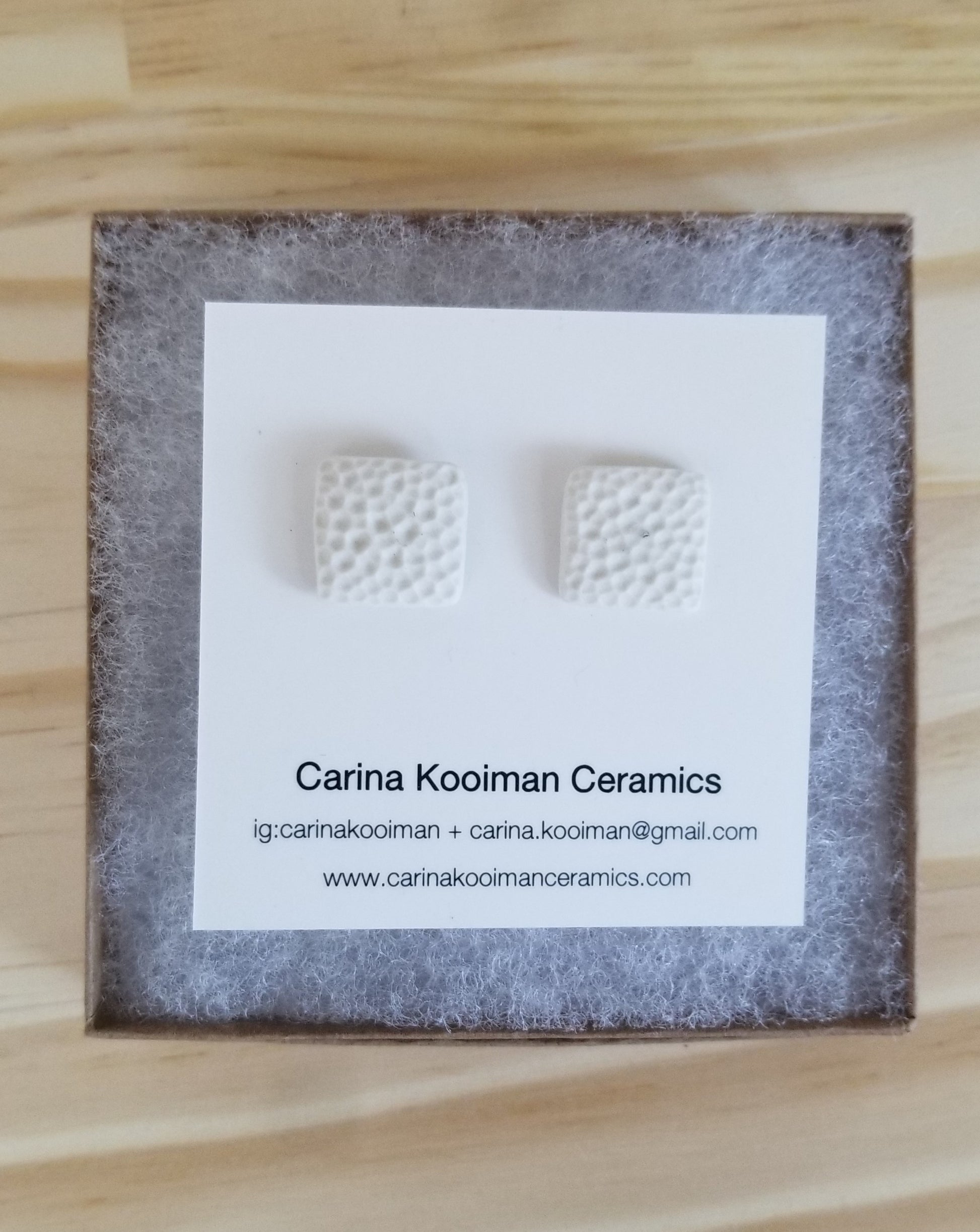Dimpled square white studs, in box. Handmade pottery. Handmade ceramics.