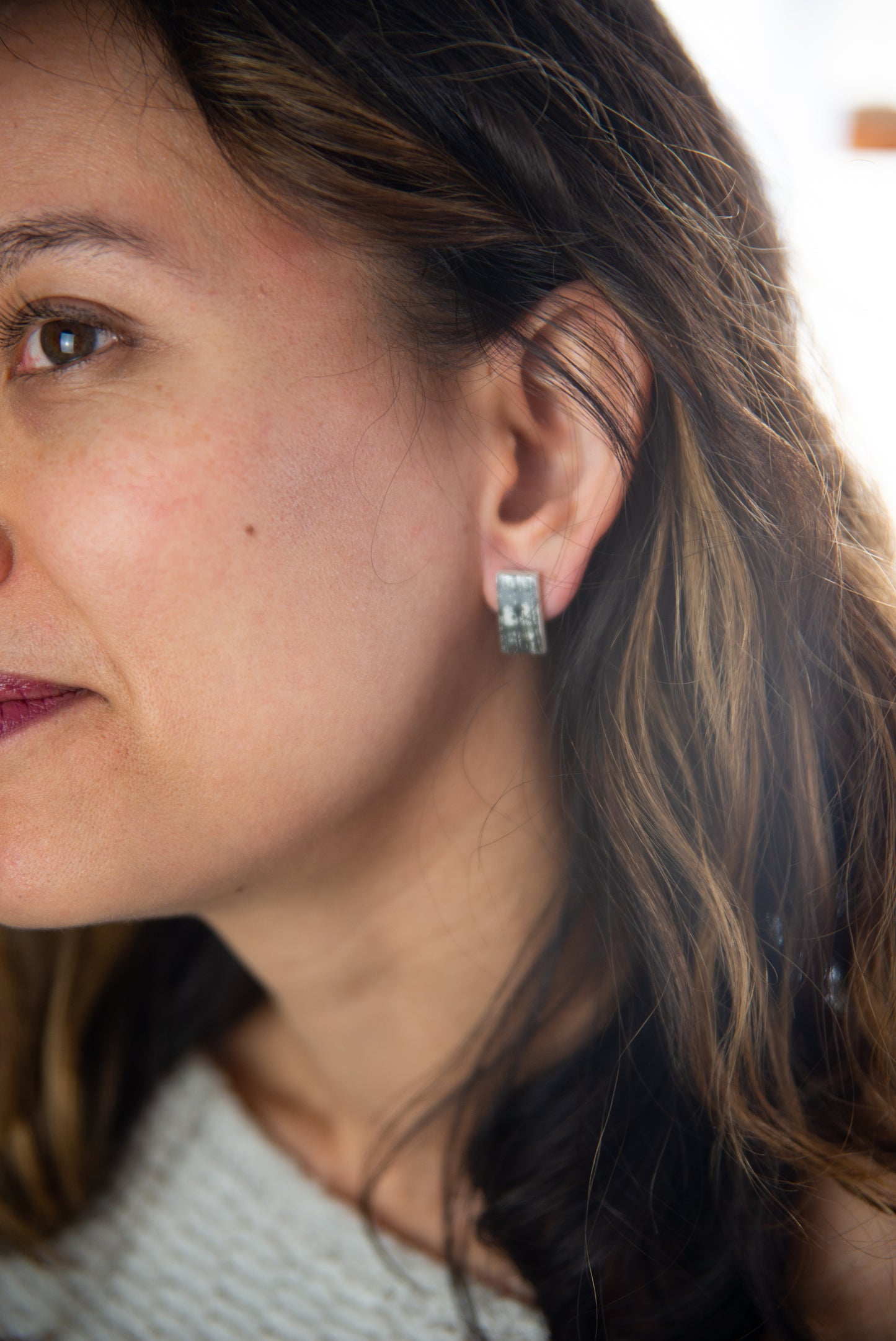 Black printed rectangle studs, lifestyle shot part 2. Handmade porcelain jewelry.